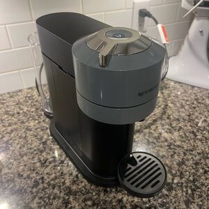 Nespresso Gray Coffee Machine with frother. Both work great and kept clean.